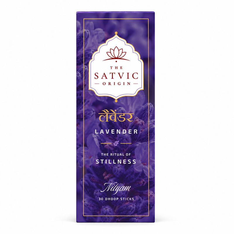 A tall rectangular purple box for The Satvic Origin Lavender Nyam diya oil lamps, featuring a white decorative label with gold and red details, set against a plain white background.