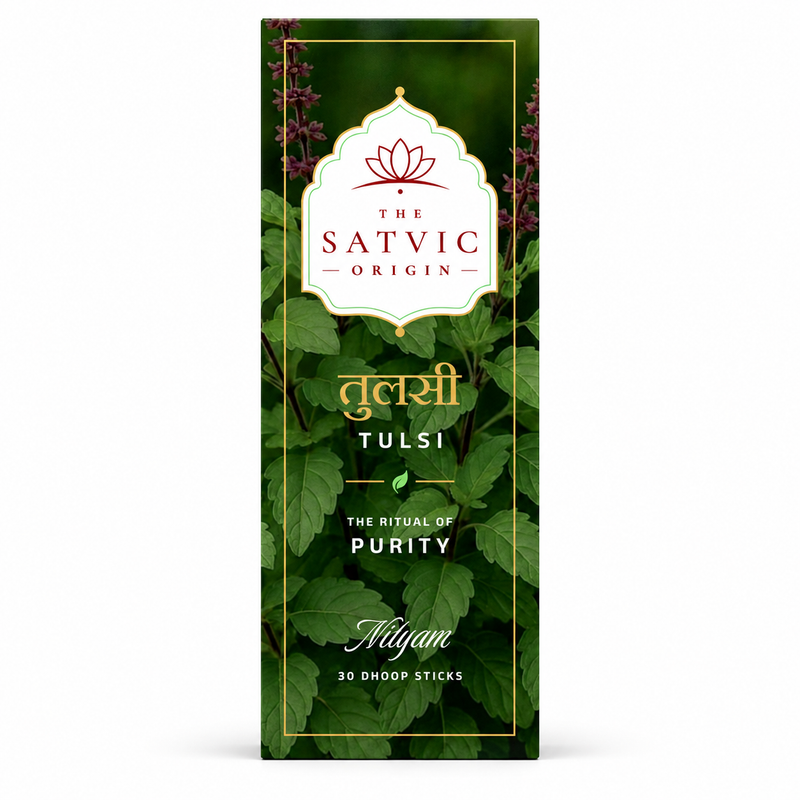 A tall rectangular box of Tulsi Omoop Sticks by The Satvic Origin, featuring a dark green background with a botanical leaf pattern, gold borders, and a white decorative label at the top.